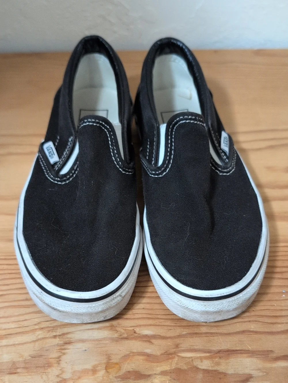 Vans Kids Slip-On Canvas Sneakers - Black & White 3.5 M/5 W (Big Kid)